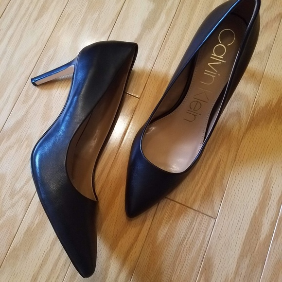 black pumps with gold accents